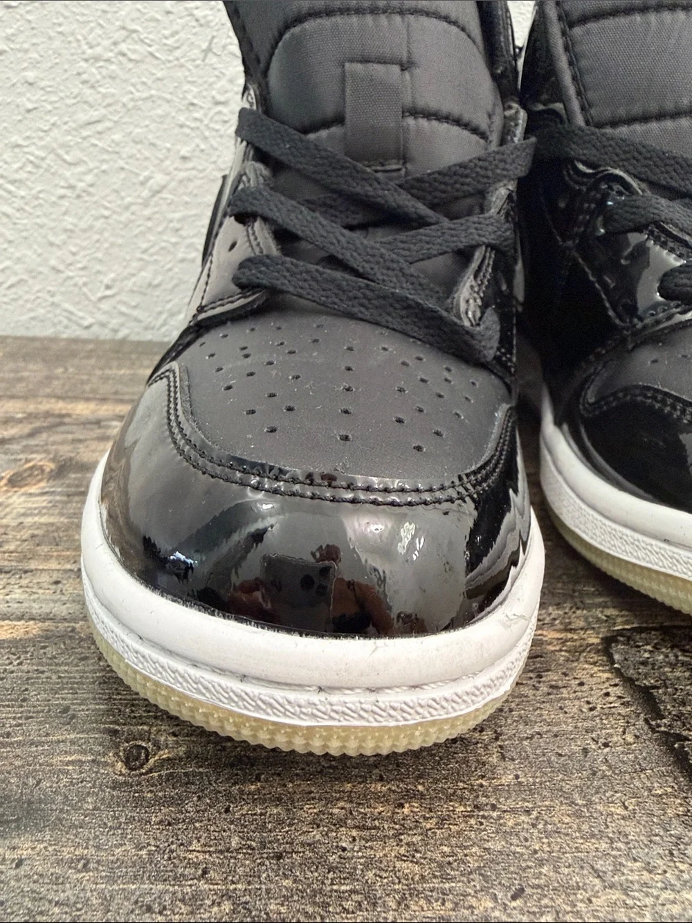 Jordan Black Patent Leather High-Top Sneakers with Purple Logo